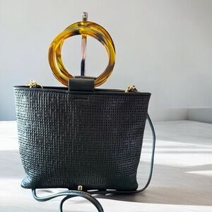 Chic Black Leather and Gold Mini Bag with Circular Handle
